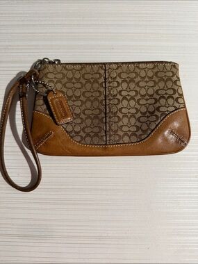 vintage Coach signature canvas and tan leather-trimmed wristlet